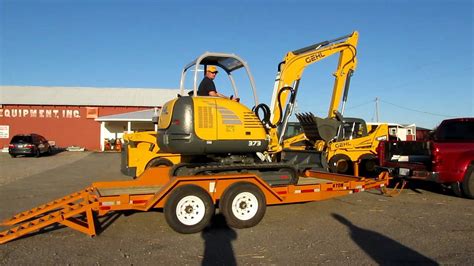 best trailer to haul mini excavator|unloading mini excavator on trailer.